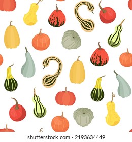 The pattern with pumpkins is seamless, on a light background. 
Different types of pumpkins, as a background, for textiles, 
packaging, wallpaper in vector. Halloween theme