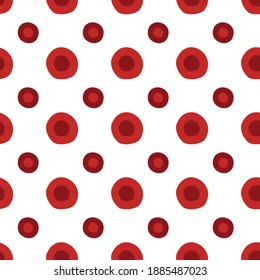 Pattern of red polka dots in different shades on a white background