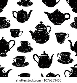 pattern of the silhouettes of teacups and teapots