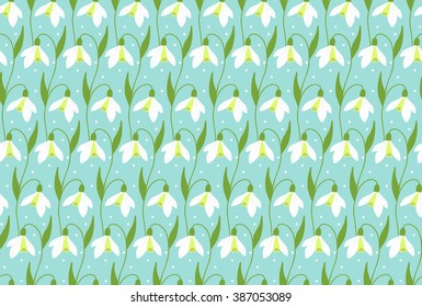 Pattern with snowdrop flowers. Seamless floral pattern. Blue background. 