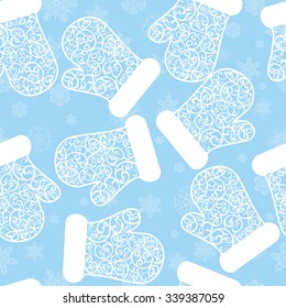 Pattern with snowflakes and mittens on blue background