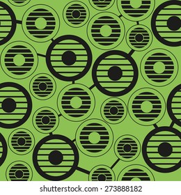 The pattern in the striped circles of different sizes on a green background
