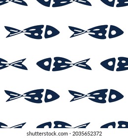 A pattern of stylized fish of dark blue color. Seamless pattern of sea fish drawn in cartoon style with patterns of dots and lines without a contour on a white background for a vector design template