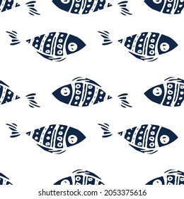 The pattern of stylized fish is dark blue. Seamless pattern of sea fish, drawn in cartoon style with dot patterns, arranged in different horizontal directions on a white background for a vector design