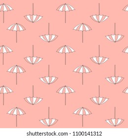 Pattern of summer beach umbrellas on pink background