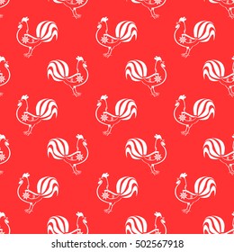 The pattern with the symbol of the New Year of the rooster or cock and snowflake.