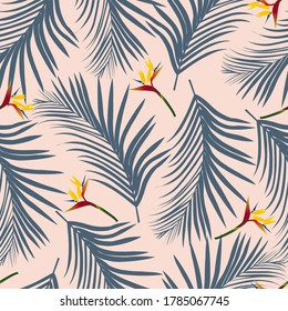 Pattern with tropical palm leaves and birds of paradise flower