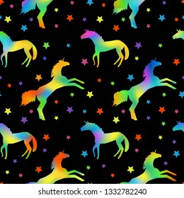 pattern with unicorn silhouettes with rainbow fill and multicolors stars on black background