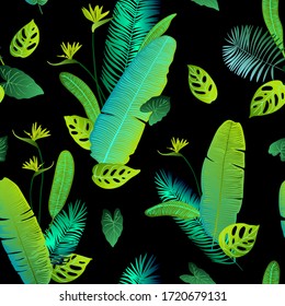 Pattern vector green neon tropical leaves of palm, monstera, fern. Plants on a black background.