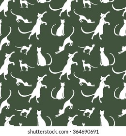 pattern of vintage cats against a dark background