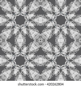 Pattern for wallpaper and textile. Seamless pattern. White abstract floral ornament on a gray background
