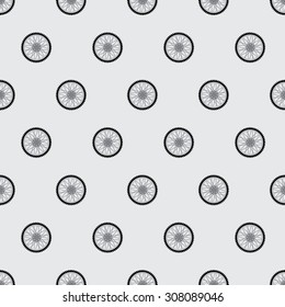 The pattern of the wheels of a motorcycle. Seamless pattern of wheels arranged offset. Wheels with black spokes and tire. Light gray background.