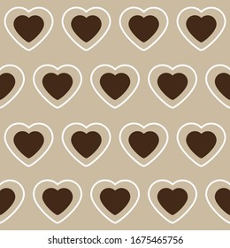 Pattern with white and brown hearts on a beige background