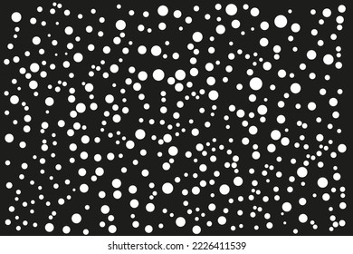 pattern of white dots of different sizes on a black background