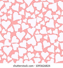 pattern of white and red hearts on a pink background