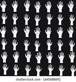 pattern of white silhouettes of hands on a dark background