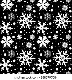 pattern with white snowflakes on a black background