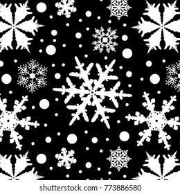 pattern with white snowflakes on a black background