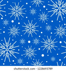 pattern of white snowflakes on blue background