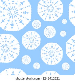 Pattern with white snowflakes on a blue background