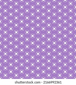 pattern of white stylized flowers on a purple background
