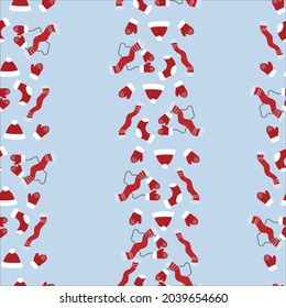 pattern with winter clothes on a blue background, red hat, scarf, socks, mittens in a chaotic manner on a light background, New Year's pattern for design on a Christmas theme