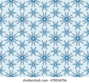pattern of winter snowflakes. New year series. Blue color. Seamless vector illustration. For the design, printing and presentations.