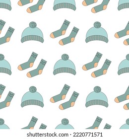 pattern of winter warm clothes socks and mittens in line art style for gift wrapping, wrapping paper