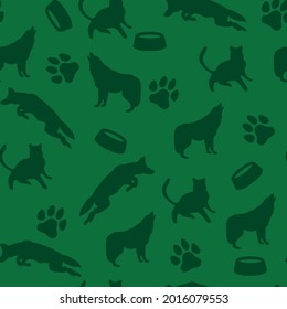 Pattern of wolves, dogs on a green background. Vector. Print for printing, factory.