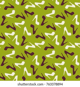 Pattern of women shoes on the green background. 