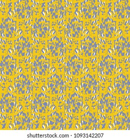 Pattern in yellow and blue with scribbles or small irregular shapes. Decorative mottled background. Vector illustration.