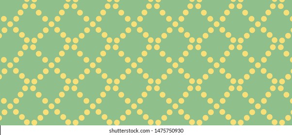 pattern with yellow circles on a green background. Grid of yellow circles