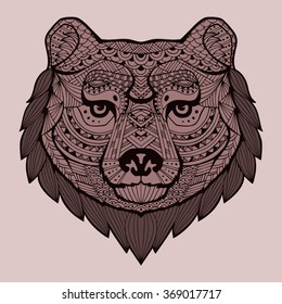 Patterned brown bear head with a black stroke on a purple background. The head of the bear and the hair around the head painted in contrasting shades of brown. Tribal ornament painted by hand. Vector