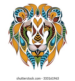 Patterned colored head of the lion. African / indian / totem / tattoo design. It may be used for design of a t-shirt, bag, postcard and poster.