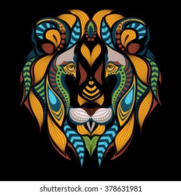 Patterned colored head of a lion. African / indian / totem / tattoo design. It may be used for design of a t-shirt, bag, postcard and poster.