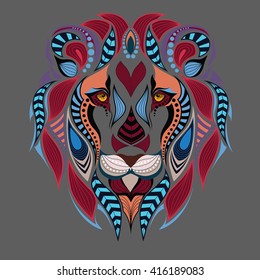 Patterned colored head of the lion. African / indian / totem / boho / tattoo design. It may be used for design of a t-shirt, bag, postcard and poster.