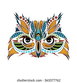 Patterned colored head of the owl. African / indian / totem / tattoo design. It may be used for design of a t-shirt, bag, postcard and poster.