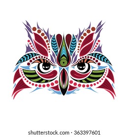 Patterned colored head of the owl. African / indian / totem / tattoo design. It may be used for design of a t-shirt, bag, postcard and poster.