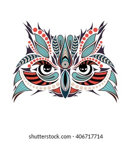 Patterned colored head of the owl. African / indian / totem / tattoo design. It may be used for design of a t-shirt, bag, postcard and poster.