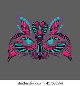 Patterned colored head of owl. African, indian tattoo design. It may be used for shirt, bag, postcard and poster.
