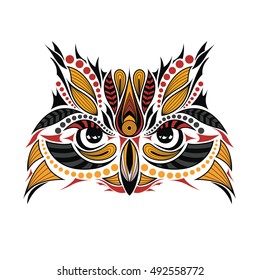 Patterned colored head of the owl. African / indian / totem / tattoo design. It may be used for design of a t-shirt, bag, postcard and poster.