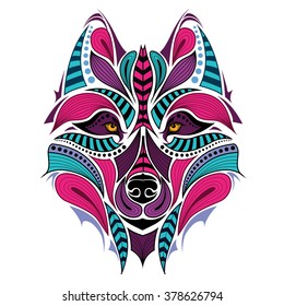 Patterned colored head of the wolf. African / indian / totem / tattoo design. It may be used for design of a t-shirt, bag, postcard and poster.