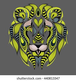 Patterned colored lion head. African, indian, totem, tattoo design. It may be used for design of t-shirt, bag, postcard and posters.