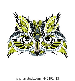 Patterned colored owl head. African, indian, totem, tattoo style. It may be used for design of t-shirt, bag, postcard and posters.