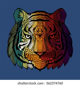 Patterned colorful head of a tiger. Abstract ethnic image of the head of a tiger with an unusual ornament. Colorful rainbow decoration painted by hand. Vector. Series of animals in the ethnic style