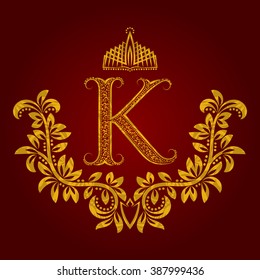 Patterned golden letter K monogram in vintage style. Heraldic coat of arms. Baroque logo template.