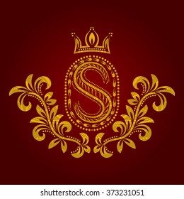 Patterned golden letter S monogram in vintage style. Heraldic coat of arms. Baroque logo template.