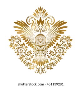 Patterned golden owl with outstretched wings. Ethnic coat of arms with owl in tribal totem style.