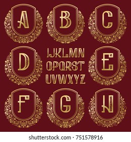 Patterned royal monogram kit. Golden letters and ornamental circular wreath frames for creating initial logo in vintage style.