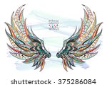 Patterned wings on the grunge background. African / indian / totem / tattoo design. It may be used for design of a t-shirt, bag, postcard, a poster and so on.  